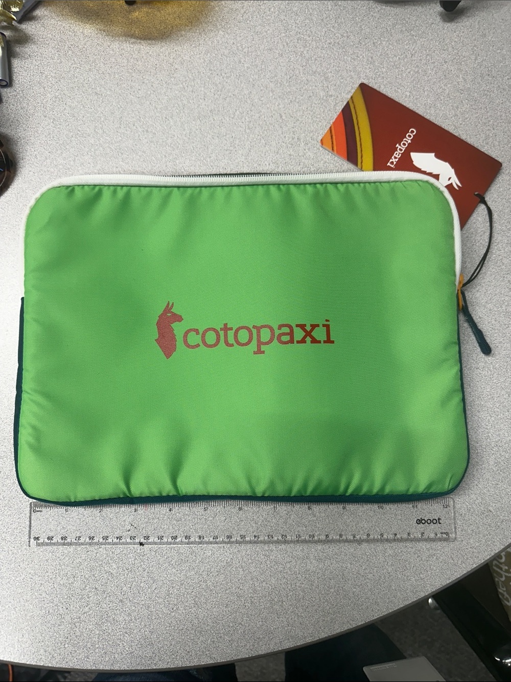 NWT Cotopaxi Trece 13” laptop sleeve Del Dia.  Green, blue, red